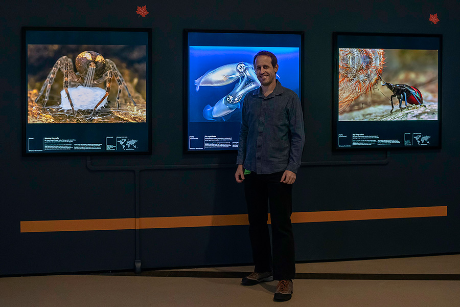 Me with two of my Wildlife Photographer of the Year winning images at Royal Ontario Museum, Toronto, Canada
